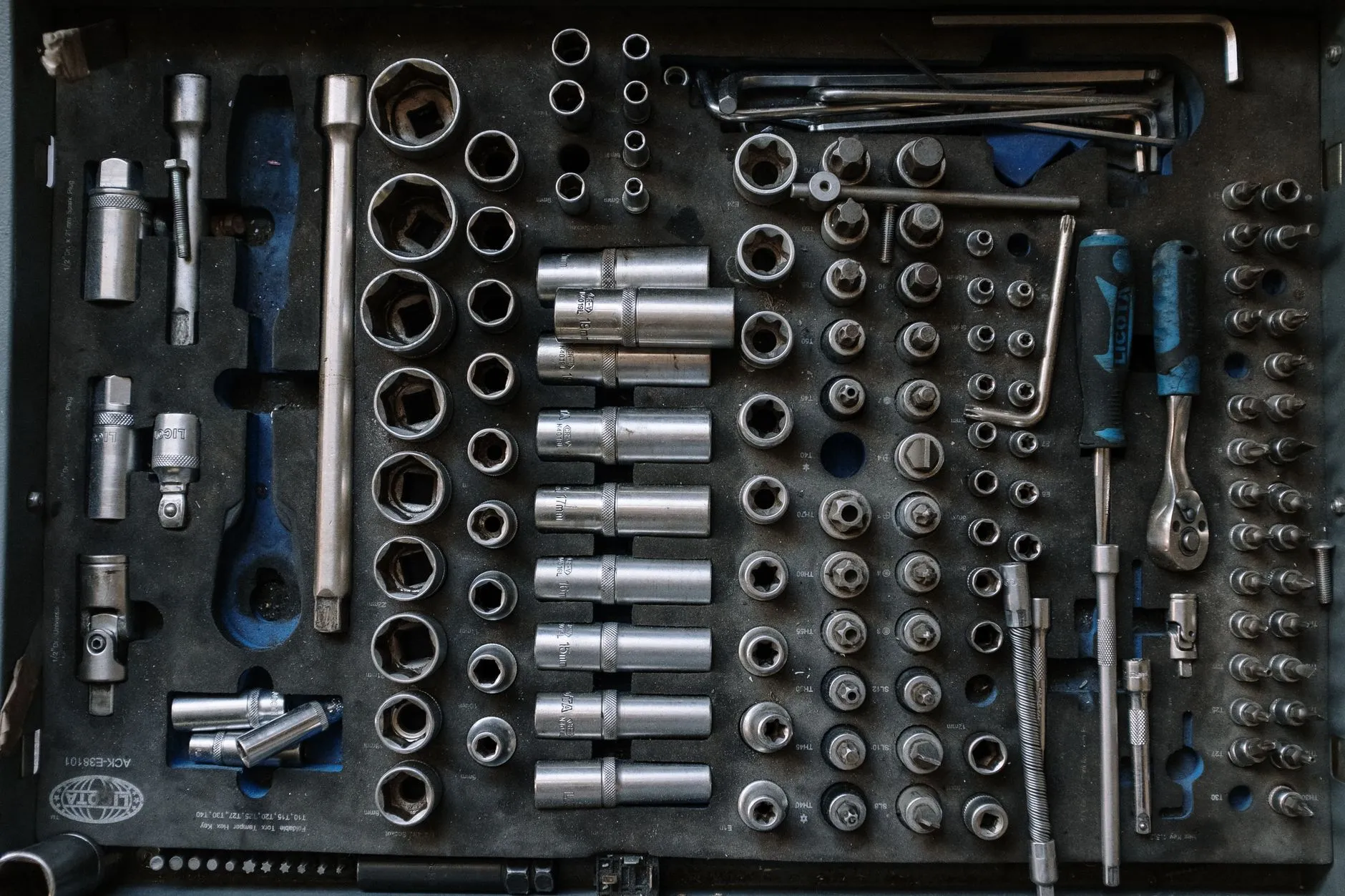 A socket set laid out in its case, every piece in its place